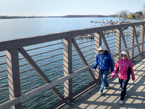Fred and Lois Parduhn of Excelsior enjoyed a view of Lake Minnetonka’s Excelsior Bay while walking on the Minnetonka LRT Regional Trail recently. The 15-mile-long trail traverses lakes, woods, meadows, neighborhoods and several towns south of the big lake. Fred and Lois Parduhn of Excelsior enjoyed a view of Lake Minnetonka’s Excelsior Bay while walking on the Minnetonka LRT Regional Trail recently. The 15-mile-long trail traverses lakes, woods, meadows, neighborhoods and several towns south of the big lake.