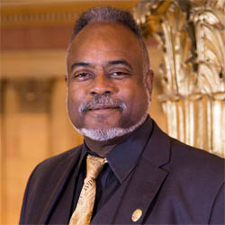 Headshot of John Harrington.