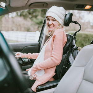 A rider in a wheelchair inside a vehicle.
