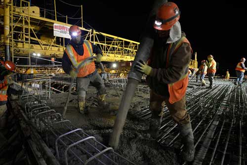 Two workers on a construction site.