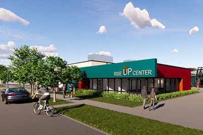 Architect’s rendering of new workforce development center shows people walking near large one-story building.