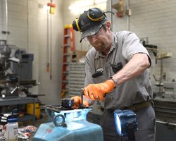person working on a machine
